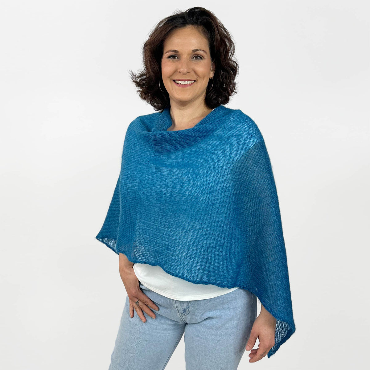 Strickponcho türkis