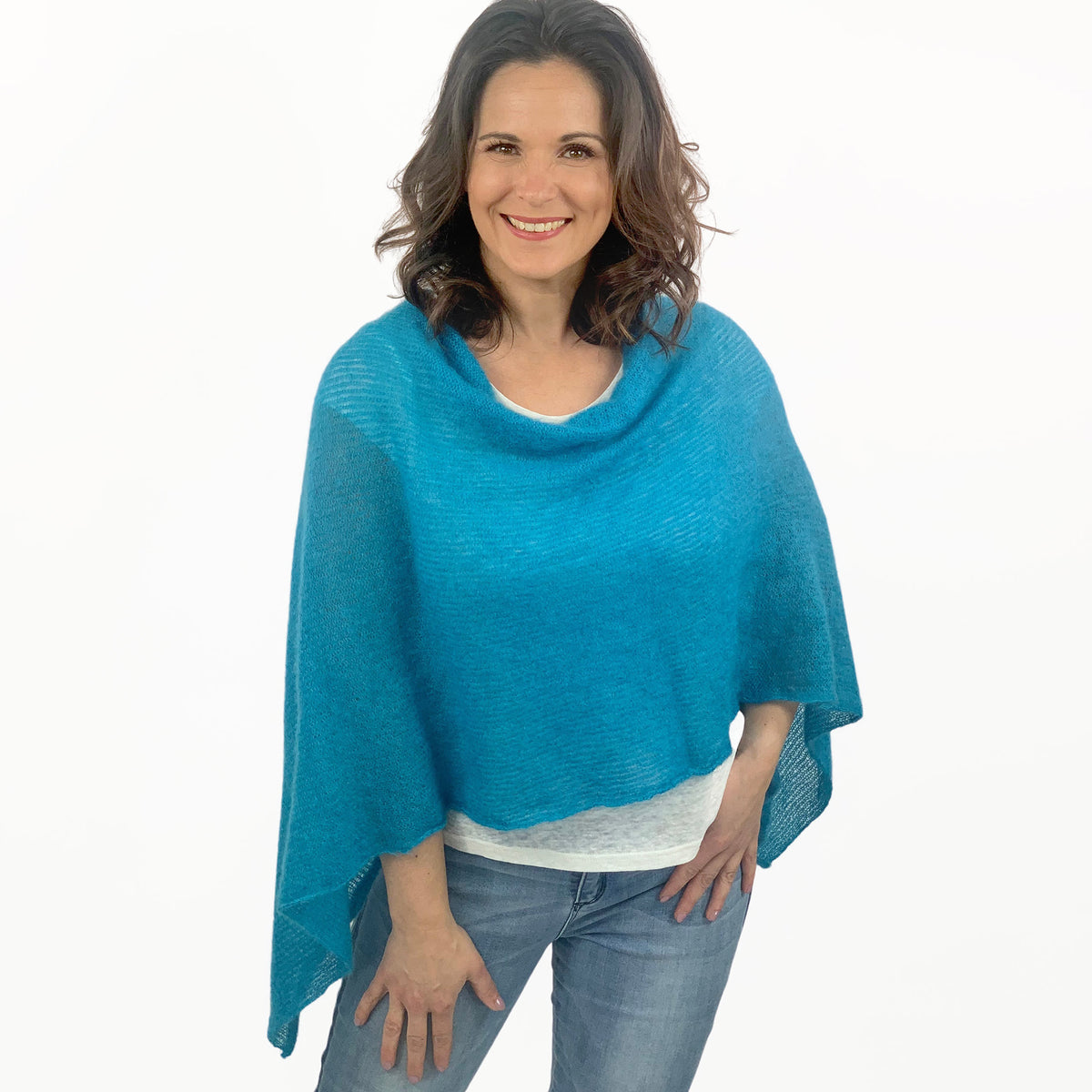 Strickponcho türkis